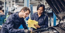 Two mechanics looking under car hood. PhotoID 166202754 © Lemusique | Dreamstime.com